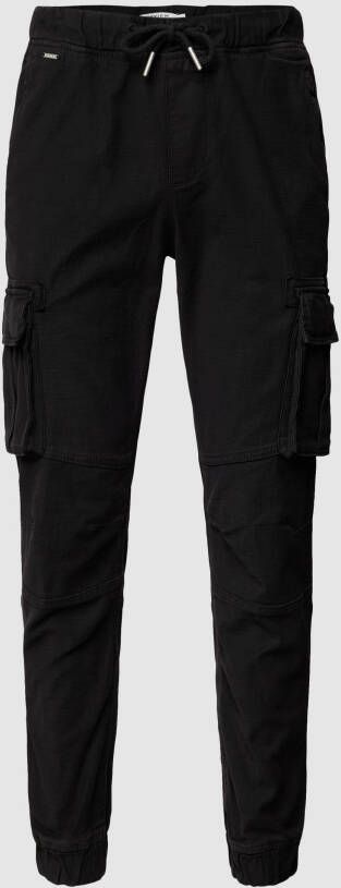 REVIEW Cargobroek met labeldetail