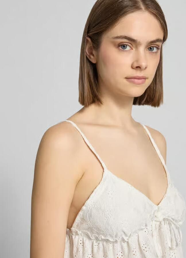 REVIEW Babydoll-top met peplumdetail en opengewerkte borduursels