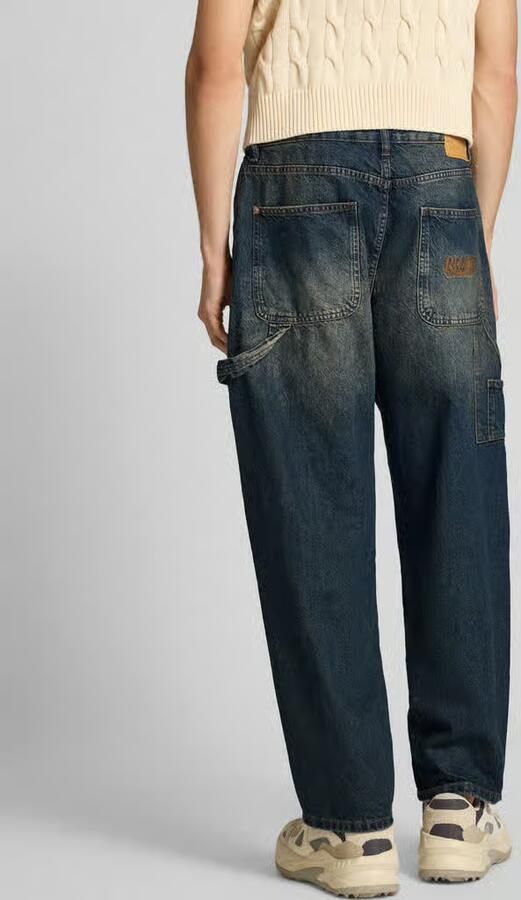REVIEW Baggy fit jeans met Franse steekzakken