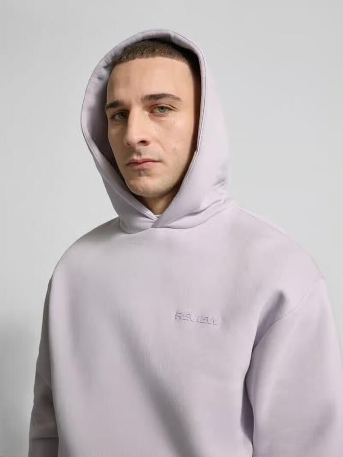 REVIEW Essentials hoodie met logo