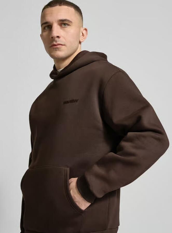 REVIEW Essentials hoodie met logo