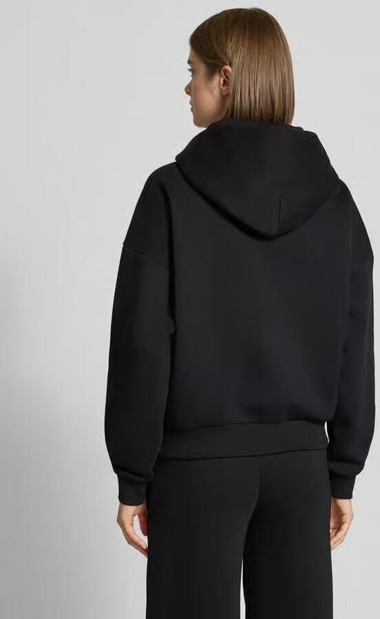 REVIEW relaxed fit sweatjack met capuchon