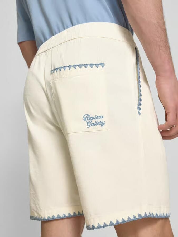 REVIEW Shorts met doorstikte rand