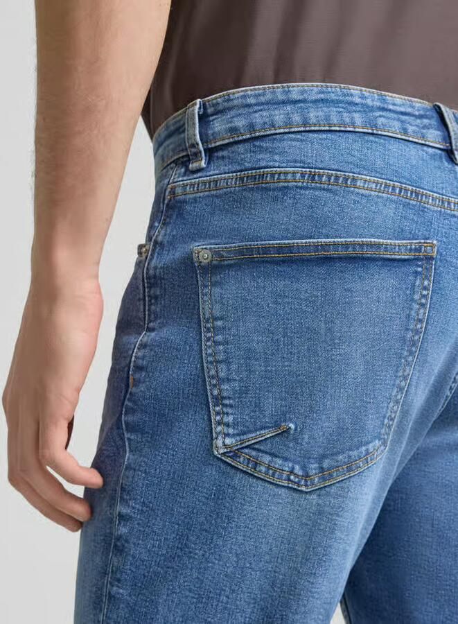 REVIEW slim fit korte jeans met omslag