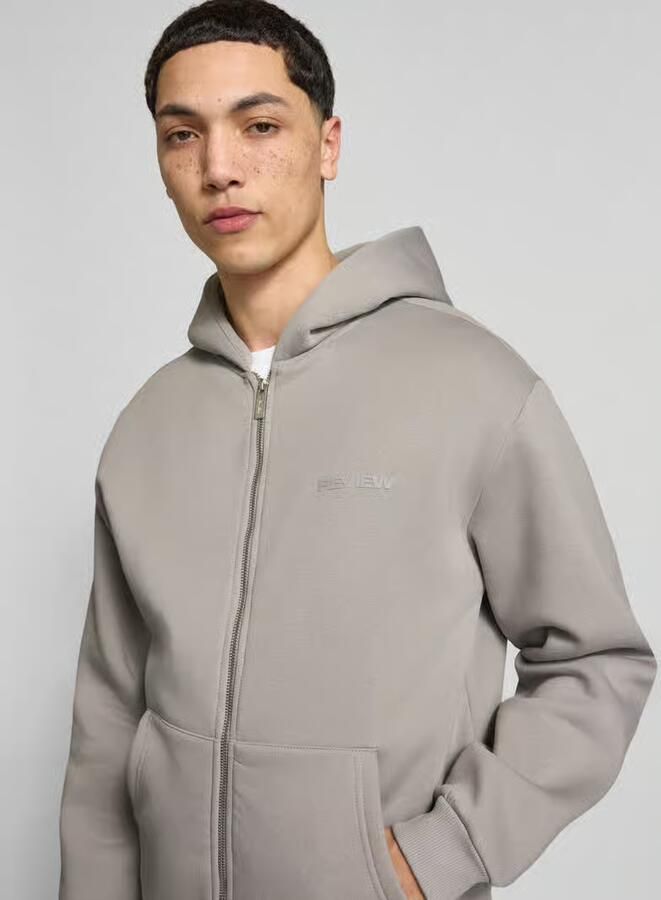 REVIEW Sweatjack met Kangoeroezak