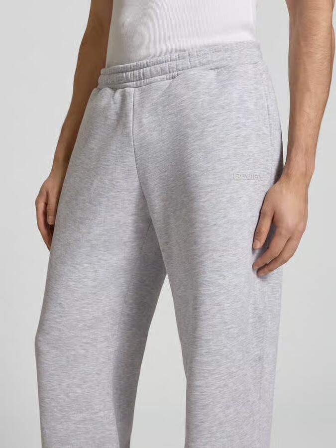 REVIEW Straight leg sweatpants met labelprint