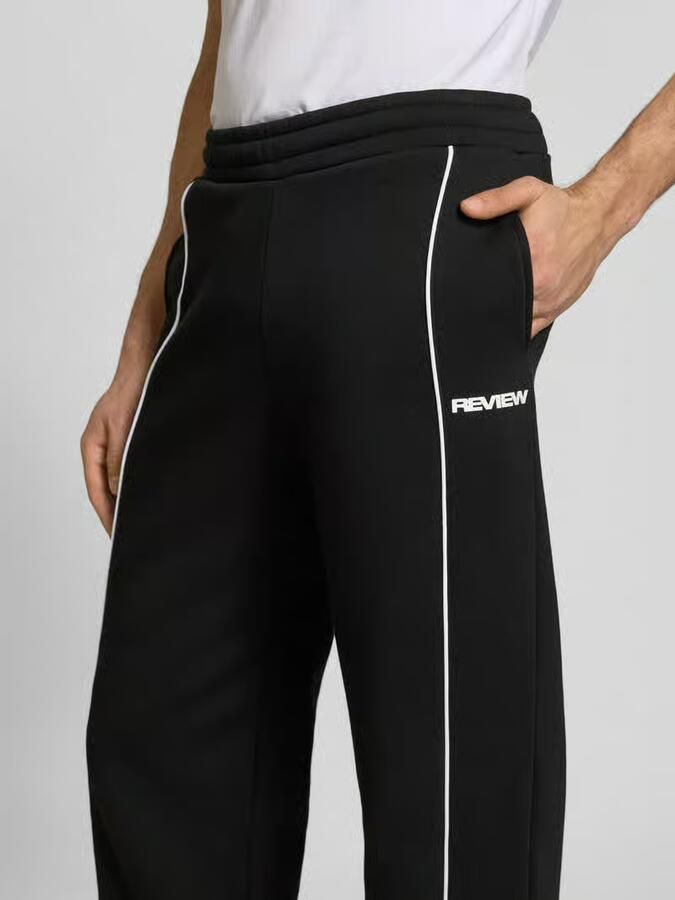 REVIEW Sweatpants met elastische tailleband en logo
