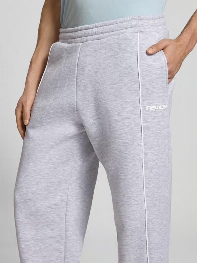REVIEW Sweatpants met elastische tailleband en logo