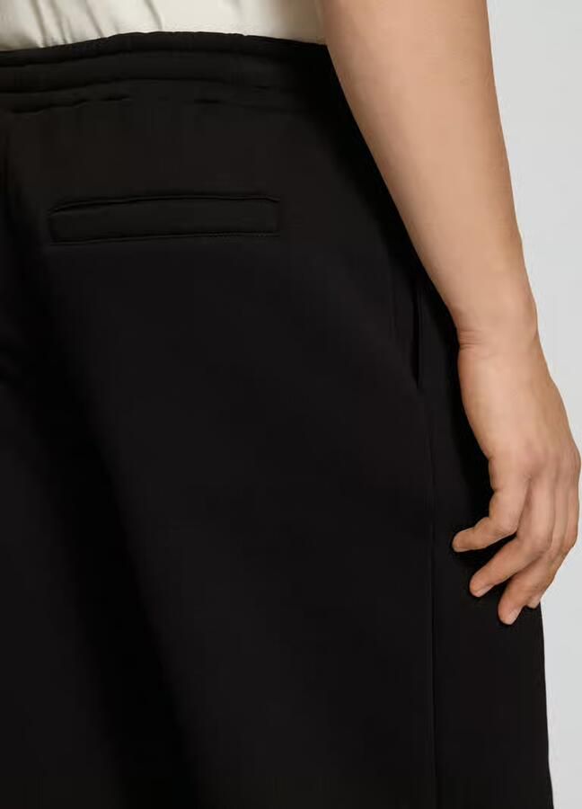 REVIEW Sweatpants met logoprint en achterzak
