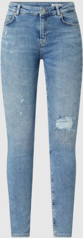 REVIEW Skinny fit jeans met destroyed-effecten