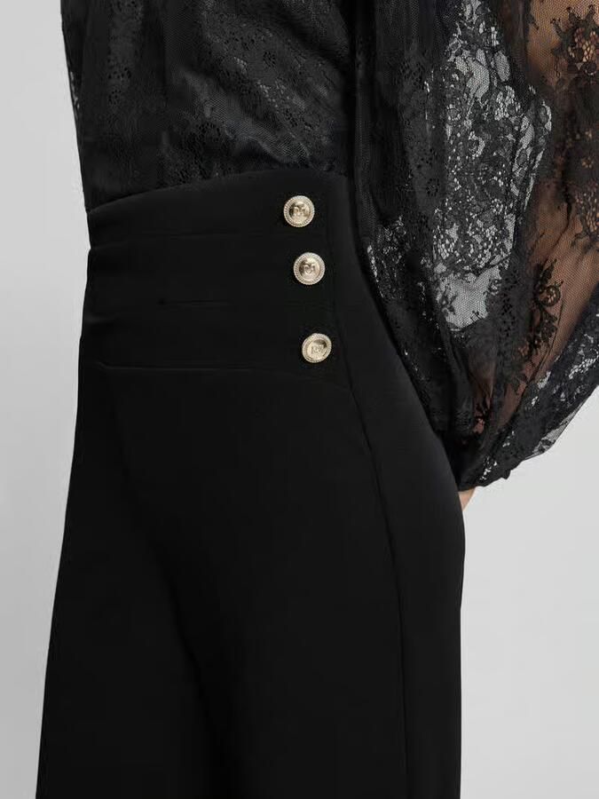 RINASCIMENTO Flared cut broek met knopen
