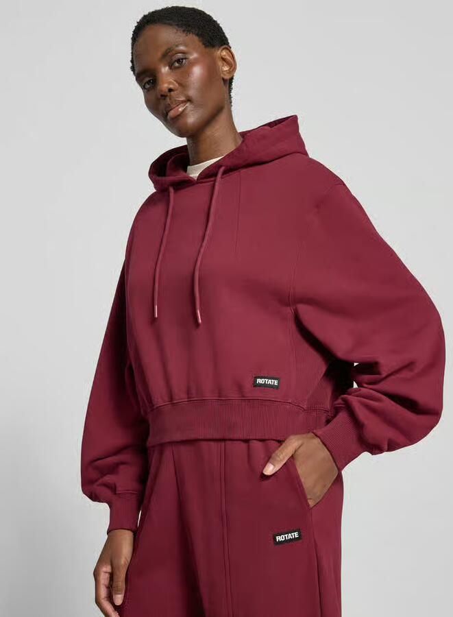 ROTATE Korte hoodie met logopatch