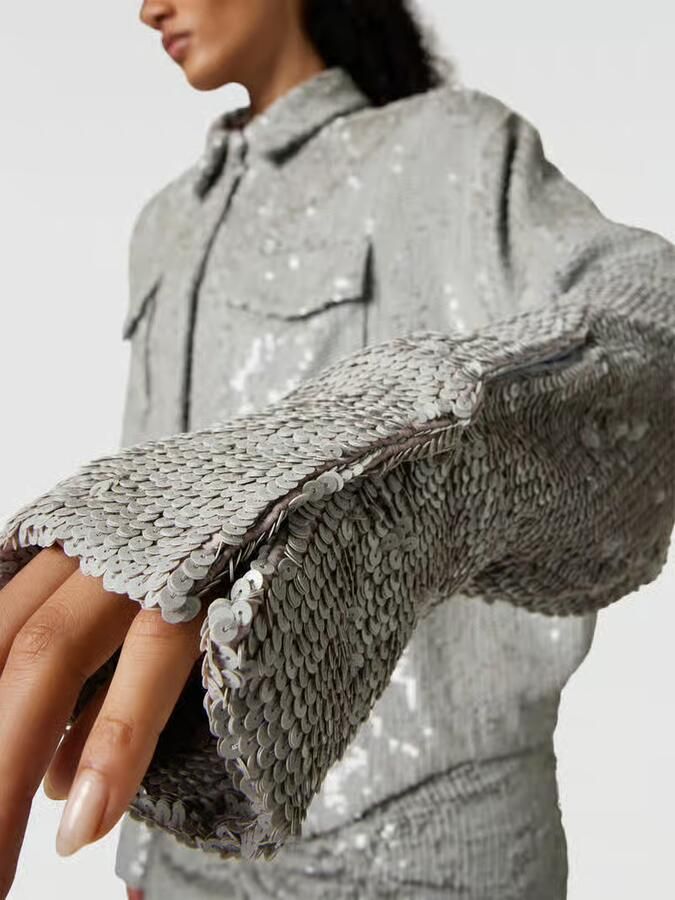 The Mannei Overhemdblouse met all-over pailletten