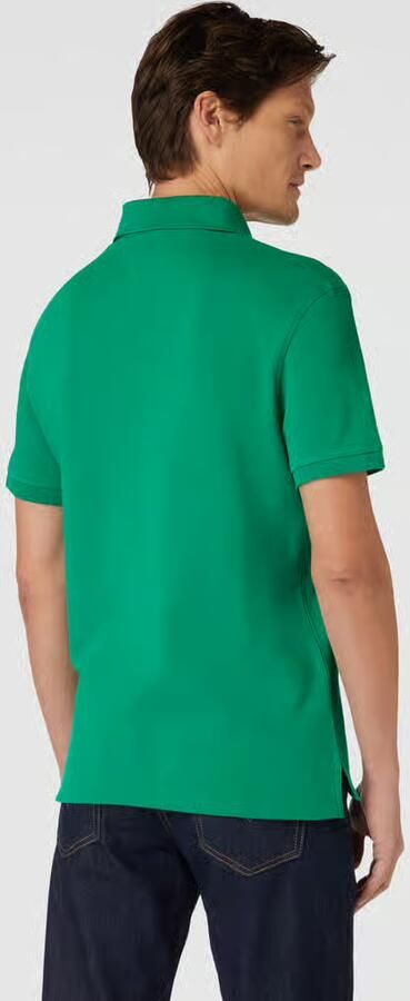Tommy Hilfiger Poloshirt 1985 SLIM POLO met piquéstructuur en borduursel gemêleerd casual slim fit katoenmix polokraag - Foto 10
