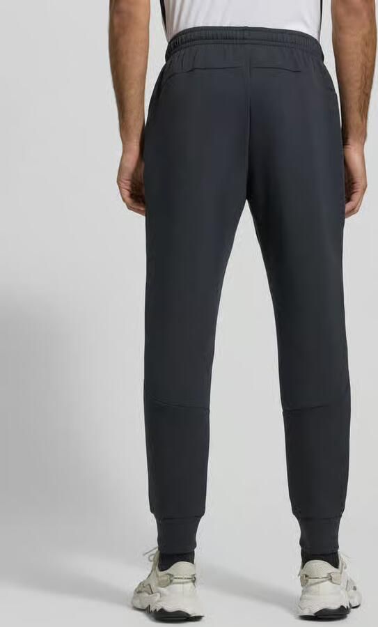 Under Armour Regular fit sweatpants met ritszak model 'UNSTOPPABLE'