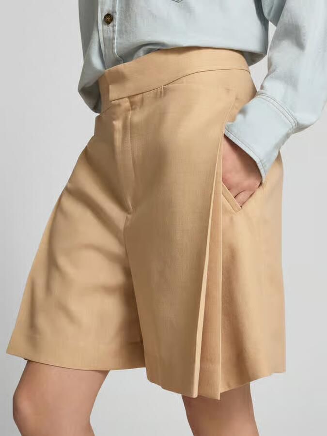 Victoria Beckham Knielange rok met steekzakken