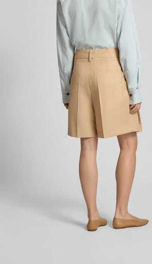 Victoria Beckham Knielange rok met steekzakken