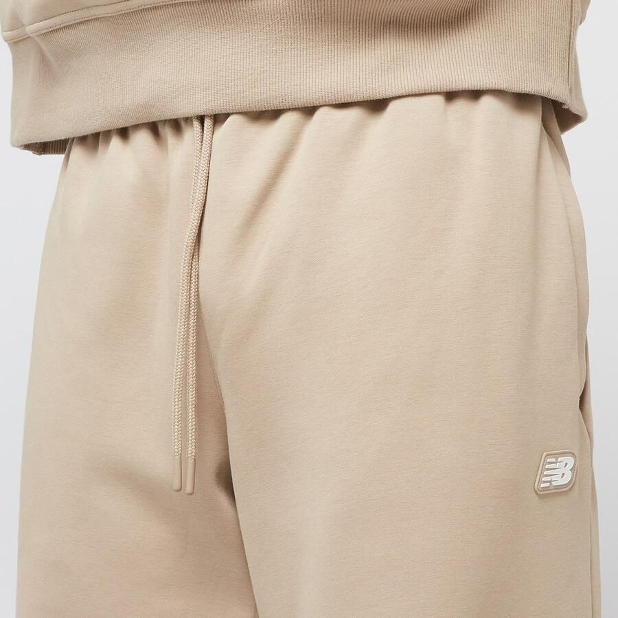 New Balance Hoops Uniform Pants Men Trainingsbroeken beige Maat XL Kleding