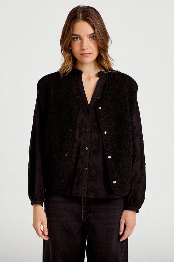 Cache teddy gilet zwart