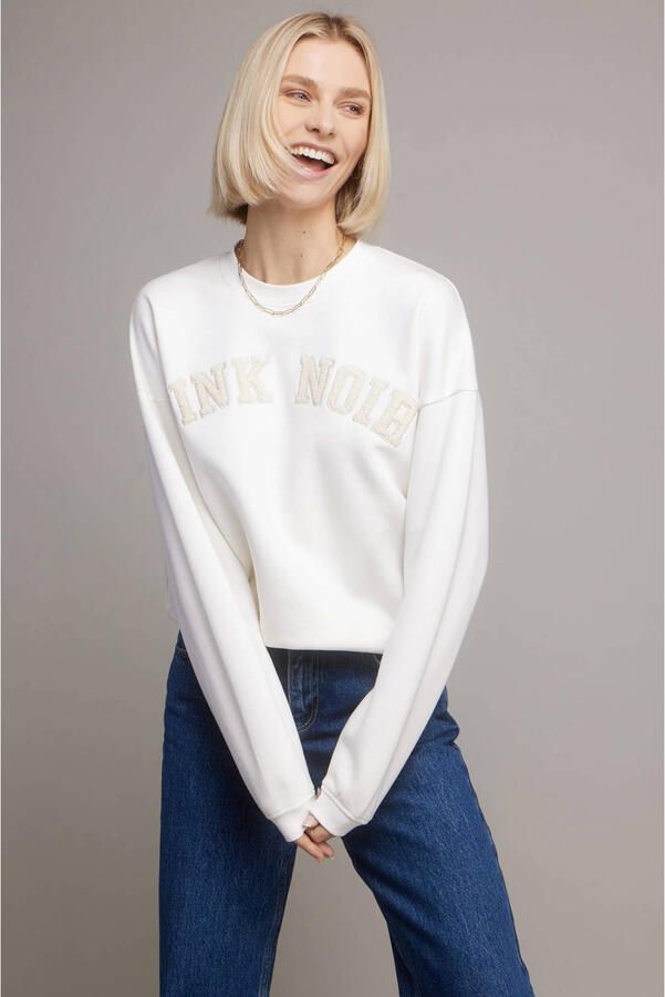 Pink Noir sweater wit