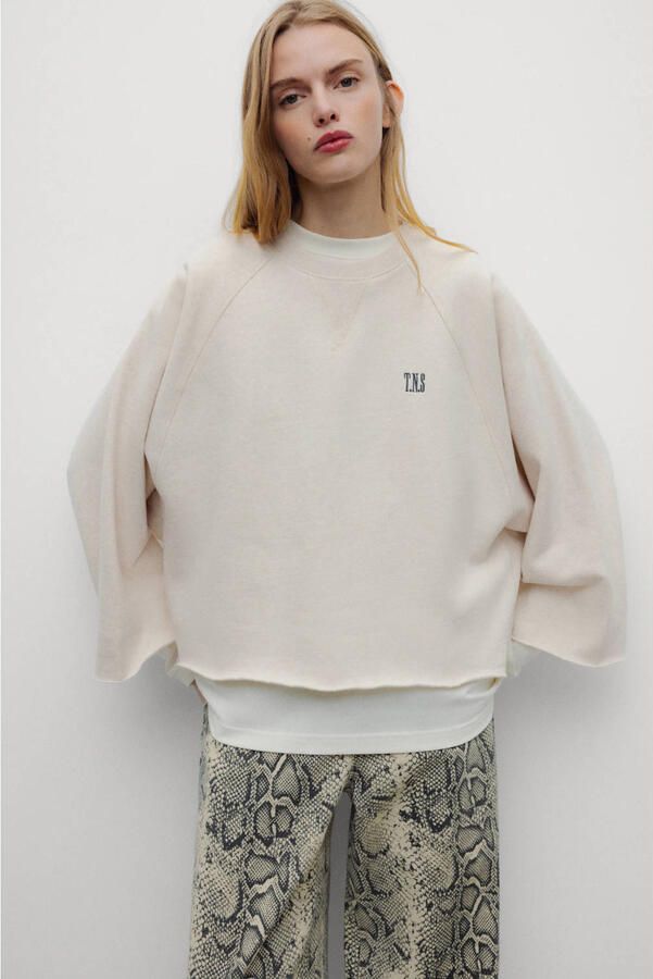The New Society sweater met logo beige