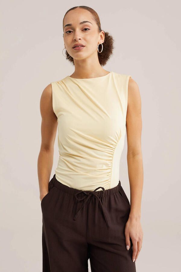 WE Fashion mouwloze top lichtgeel