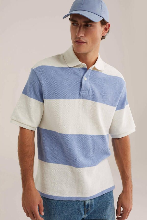 WE Fashion relaxed fit gestreepte polo blauw