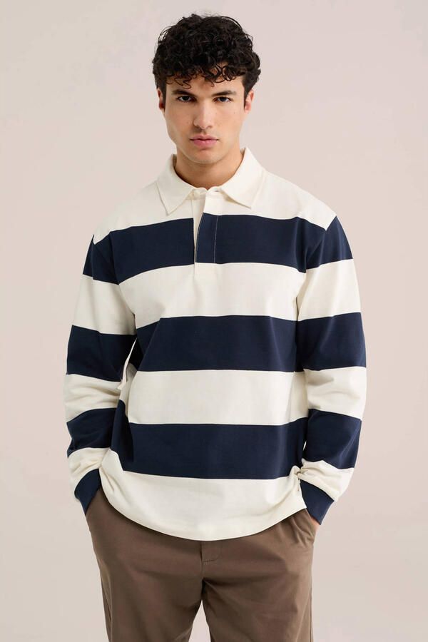 WE Fashion relaxed fit gestreepte polo blauw