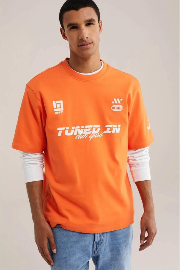 WE Fashion relaxed fit T-shirt met print oranje