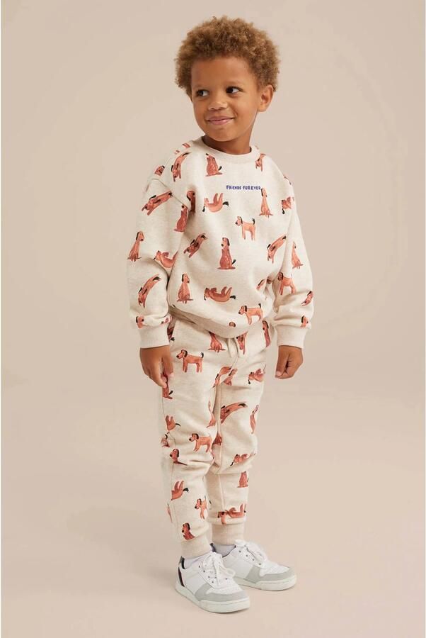 WE Fashion slim fit broek met all over print beige bruin